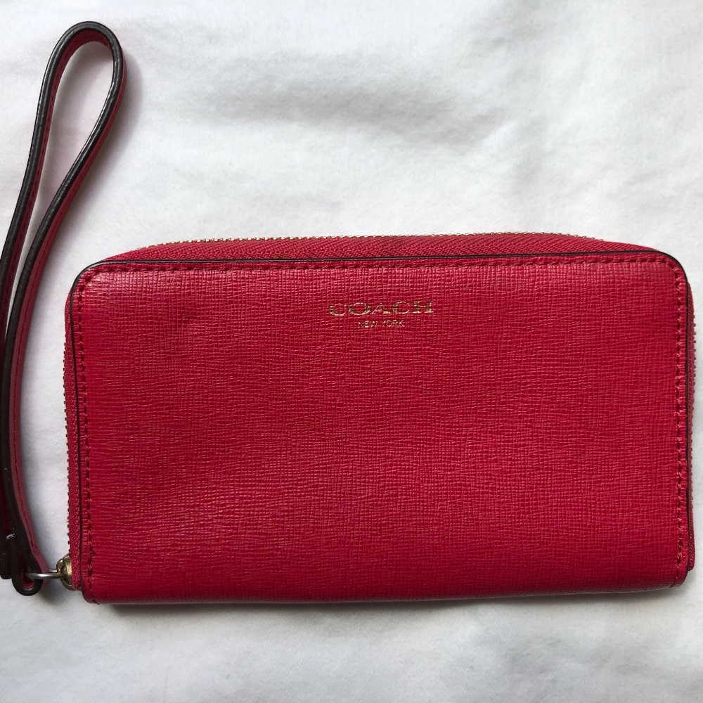 COACH Pink wristlet wallet with zipper closure